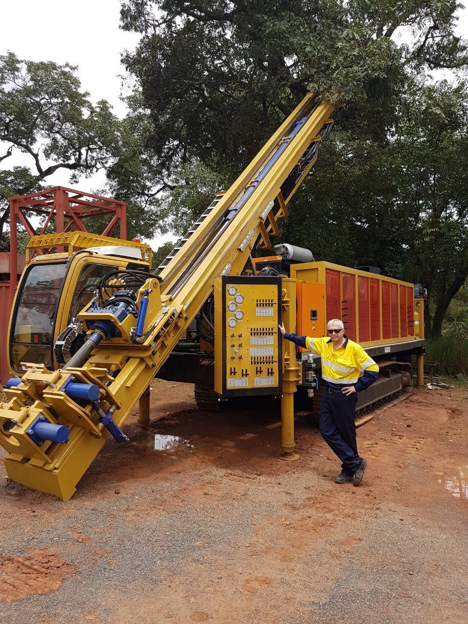 Photo of Heinz with the drill rig in Zambia